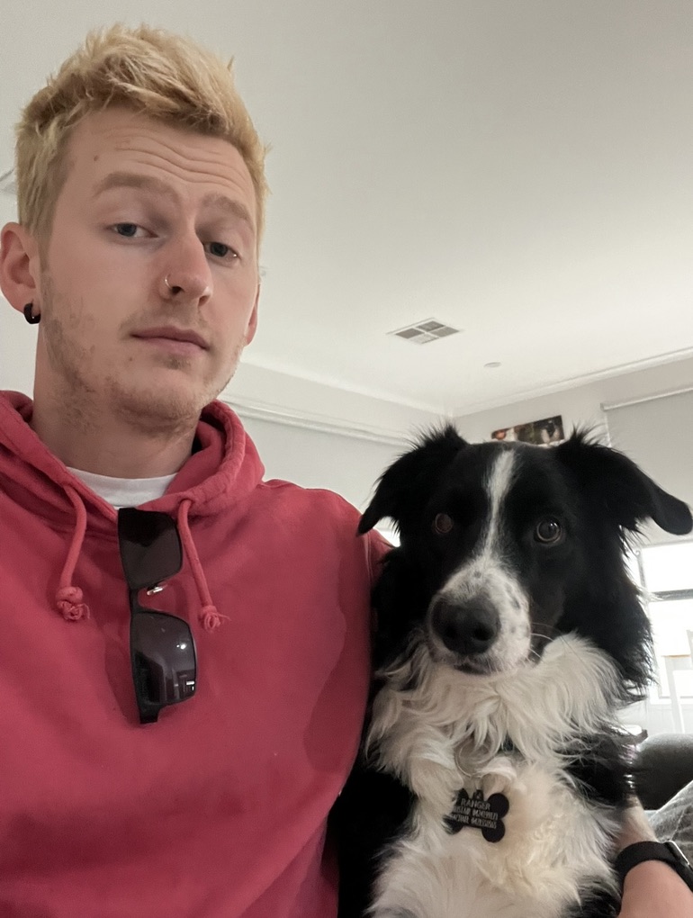 Alistair with his black-and-white dog